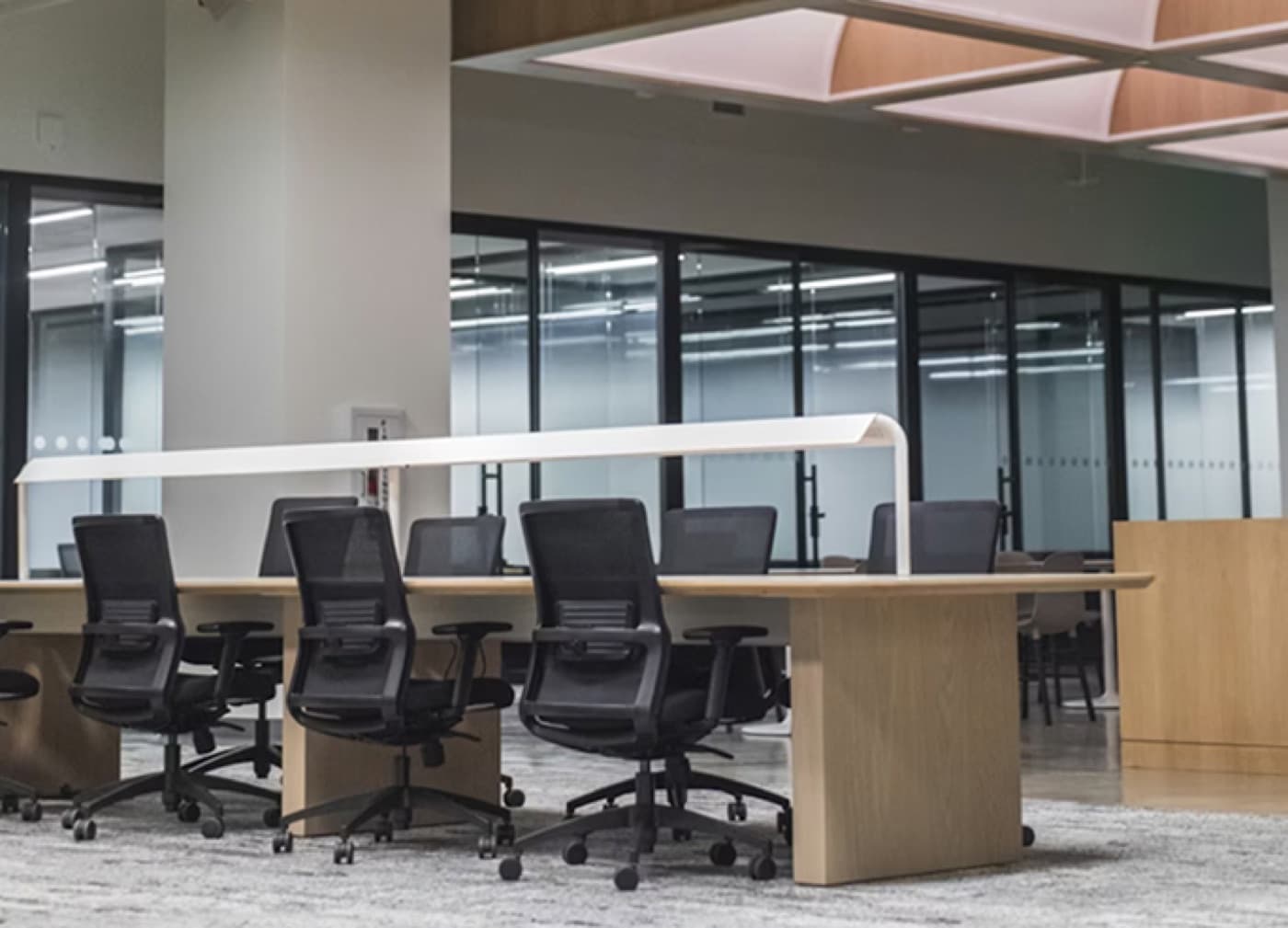 An open-plan workspace with shared desks